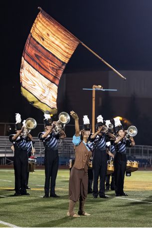 The UHS Baritones and colorguard perform