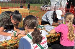 Juniors Paridhi Jain and Anusha Sudheer apply Henna at the Community Fair.