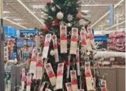 An angel tree tagged with children’s wishlists at a local Walmart.