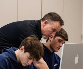 Mr. Starkey, part of the Business Department, teaching students in his AP Computer Science Class