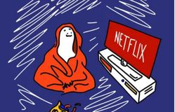 Person in blanket watching Netflix