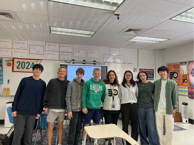 Ms. Toy poses with her students after winning the Educator of the Year Award.