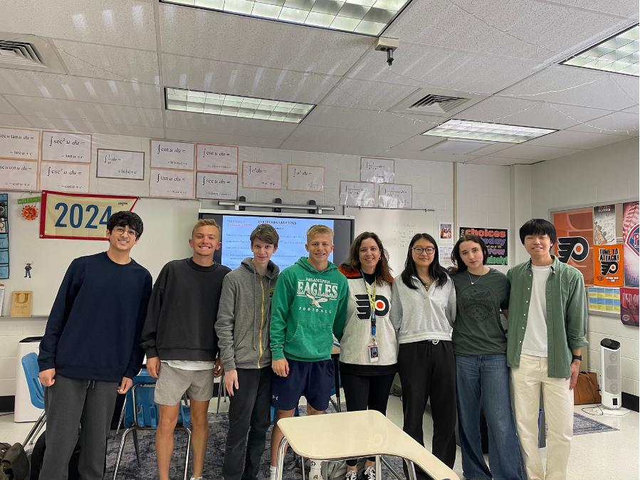Ms. Toy poses with her students after winning the Educator of the Year Award.